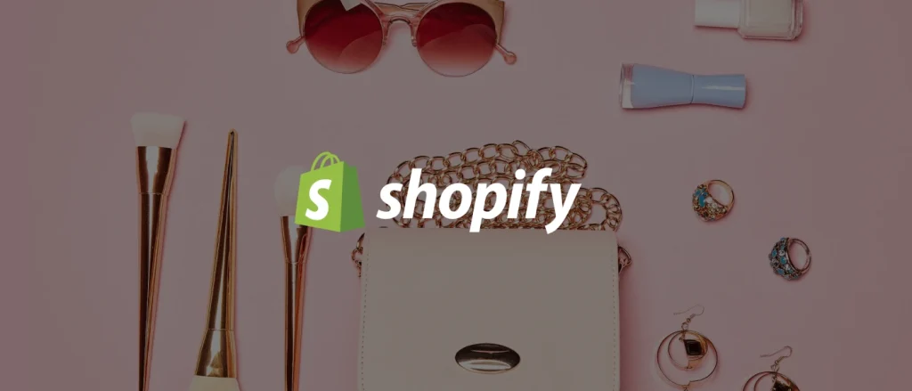 Sunglasses, handbag and jewelry around a Shopify logo on a pink background