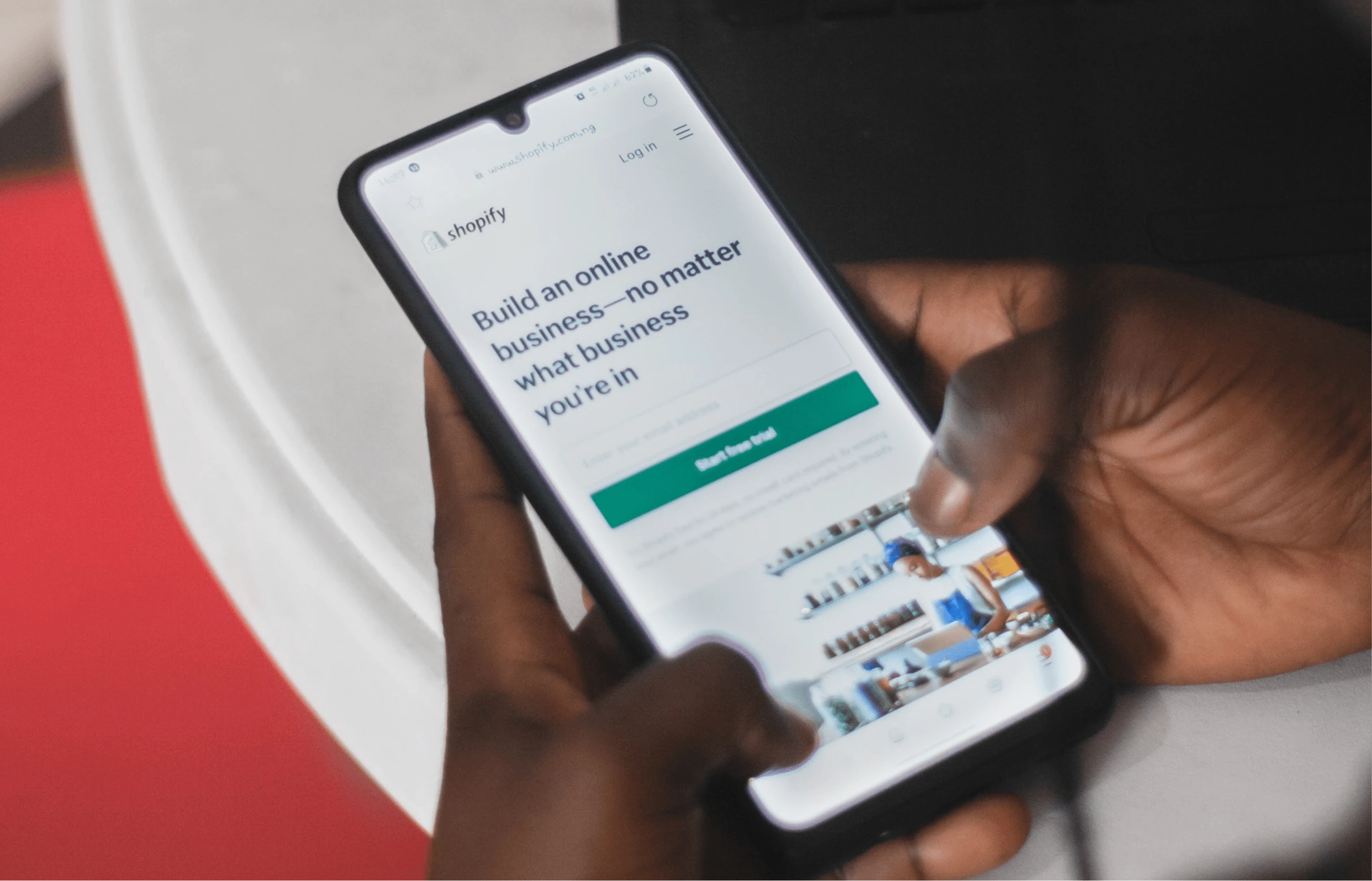 holding cell phone showing shopify home page 1 - Shopify ERP Sync Issues: Common Causes and Fixes Shopify ERP Sync Issues: Common Causes and Fixes