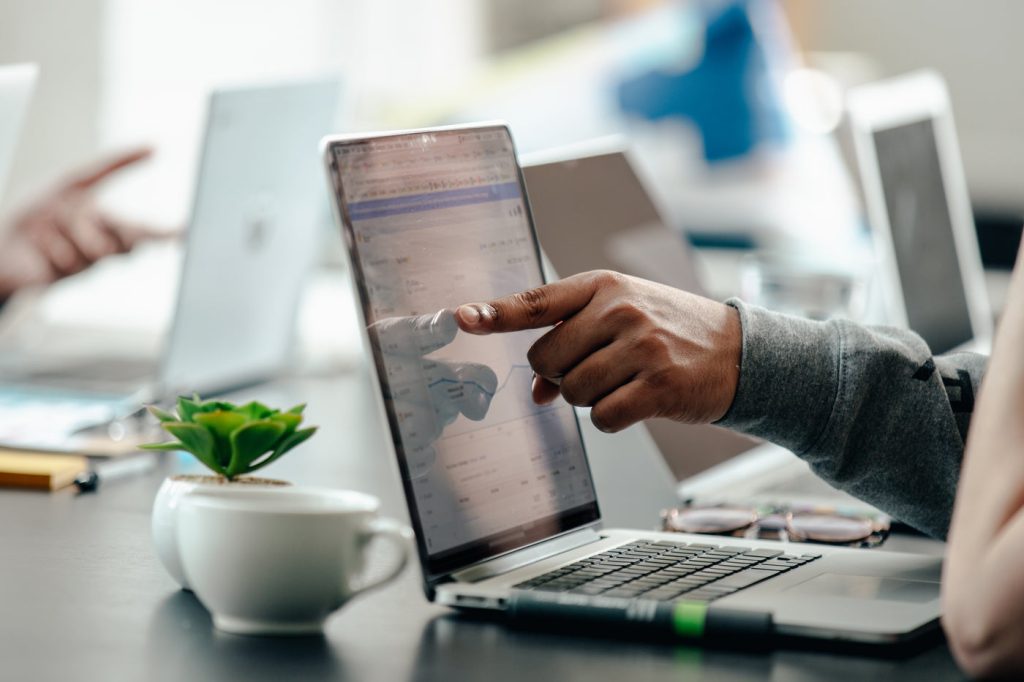 Analyst reviewing a Shopify Plus agency performance dashboard - CRO and retained support