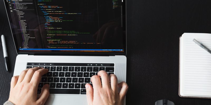 Developer writing Shopify Functions for checkout logic