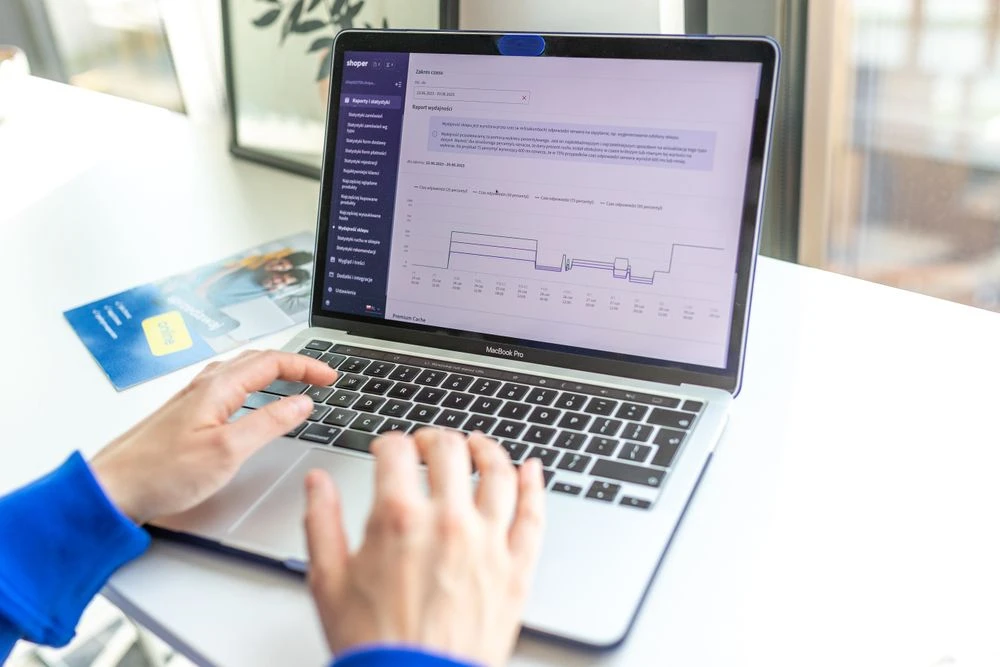 Hands analyzing online store data — Shopify SEO