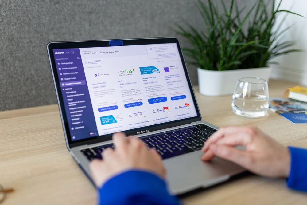 Shopify-style laptop ecommerce dashboard — Custom Shopify Sections