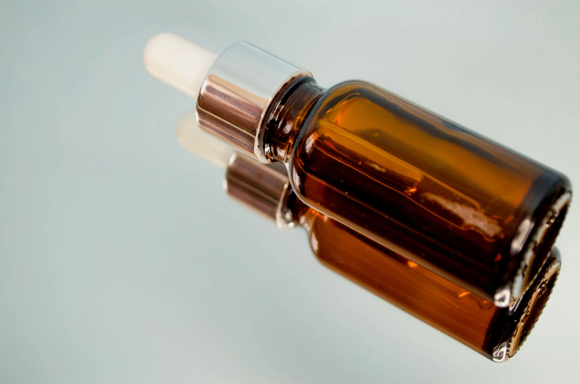 Amber glass dropper bottle for a wellness and supplement brand