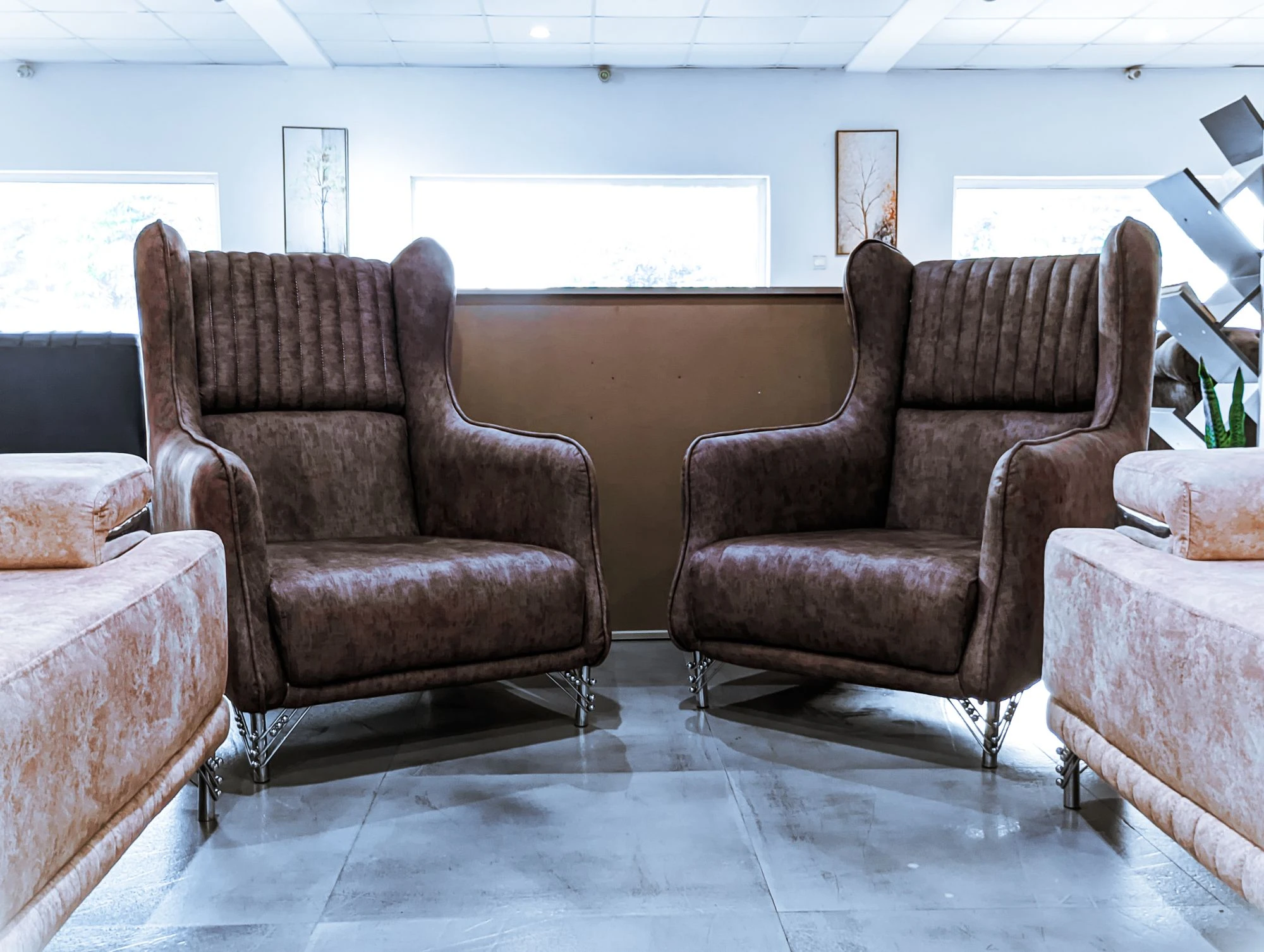 Two leather armchairs in a modern furniture showroom